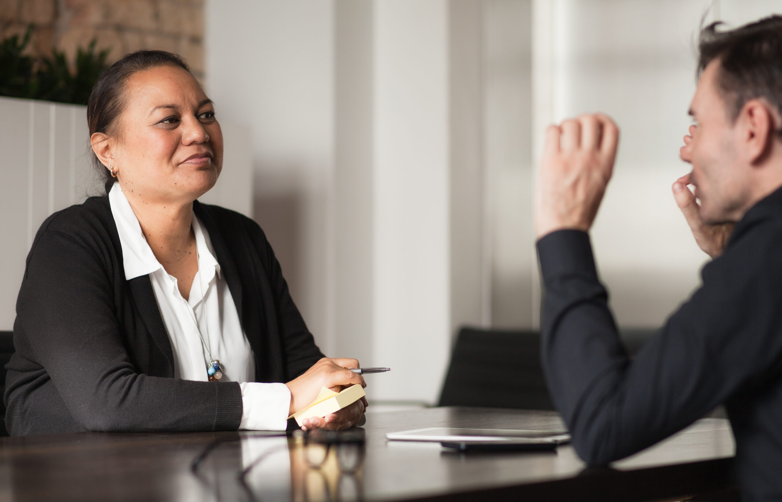 Two different ethnicity People Holding a meeting.